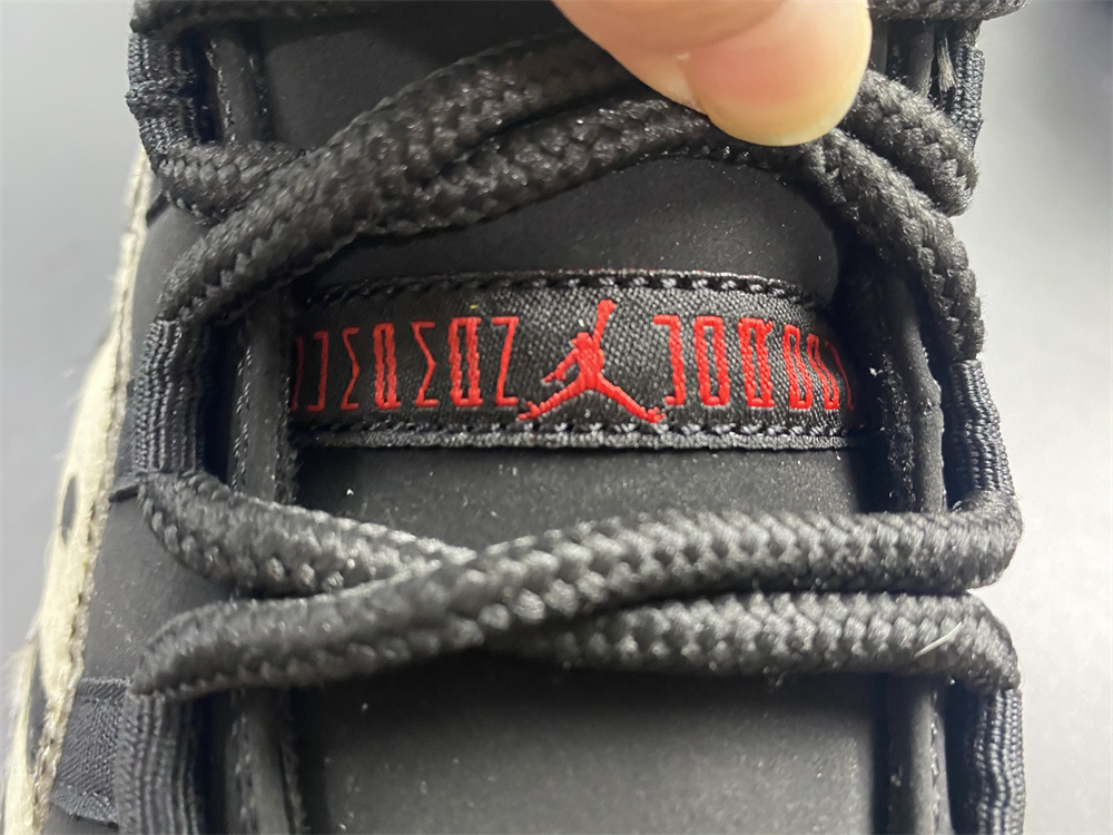 Air Jordan 11 “Animal Instinct” Black / Red / Sail / White